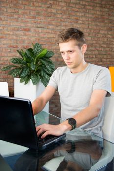 Young man working on laptop 