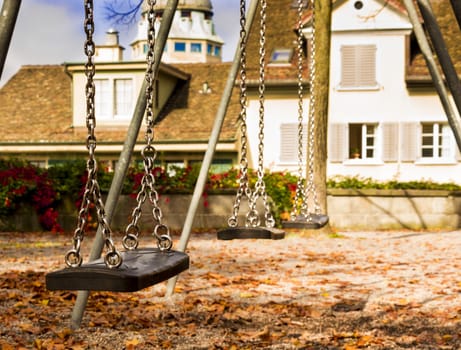 Swings in the park on an autumn day