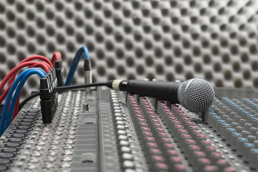 Microphone close-up on the studio mixer