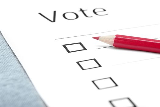 Voting bulletin with red pencil on a table