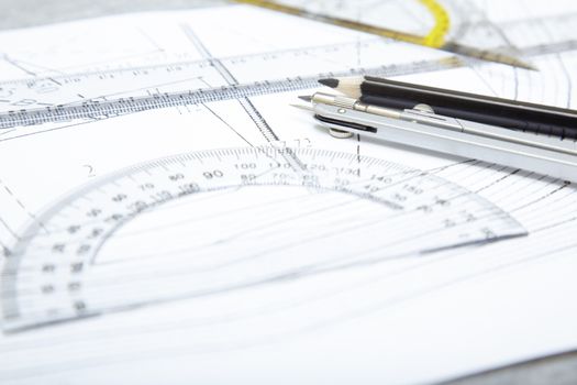 Scheme with compasses rulers and pencil. Close-up photo