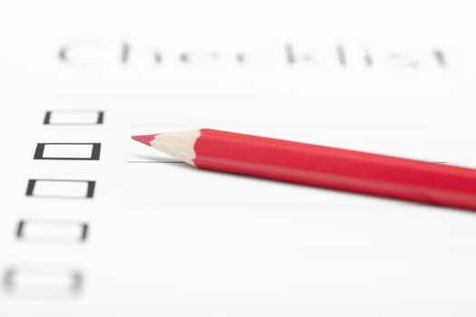 Red pencil on a daily plan. Horizontal photo