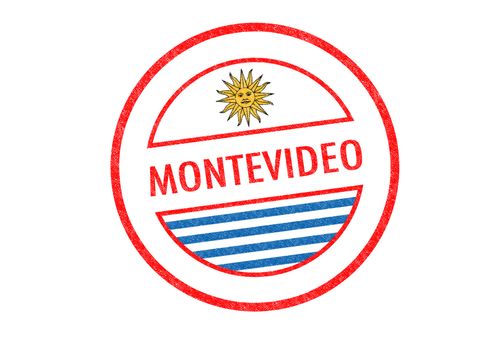 Passport-style MONTEVIDEO rubber stamp over a white background.