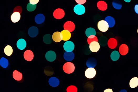 Colorful natural bokeh texture on dark background