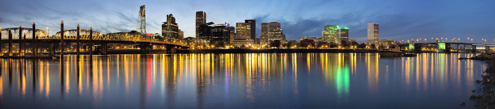 Portland Oregon Waterfront City Downtown and Bridges Along Willamette River from Eastbank Esplanade at Evening Blue Hour