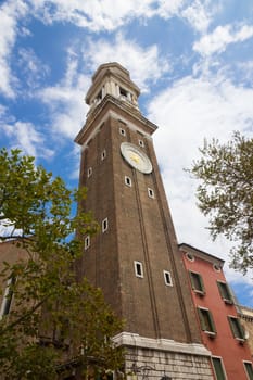 Picture of a tall church tower in Venezia