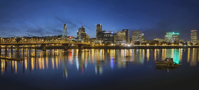 Portland Oregon Downtown Skyline with Hawthorne Bridge Along the Banks of Willamette River at Evening Blue Hour Panorama