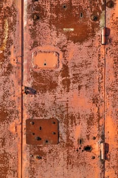 Close up of red rusty steel gate surface
