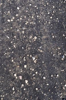 Close up of dark weathered asphalt background