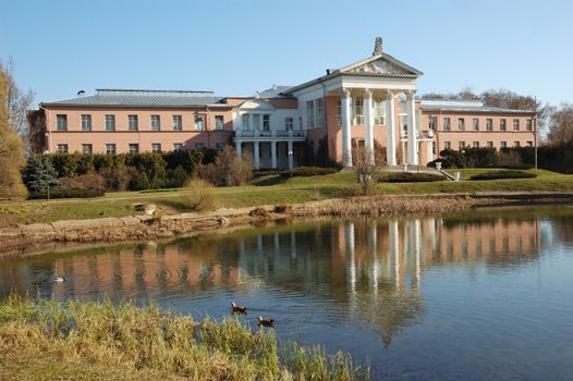 View of office building with pond in Moscow botanical gardens