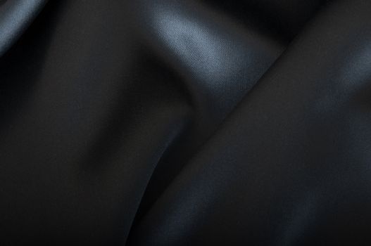 Black Texture - Closeup of Dark Wavy Glossy Silk Drapery 