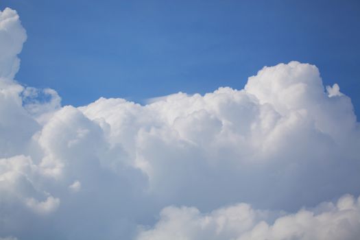 Big cumulus cloud against the blue sky