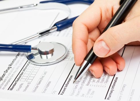 Doctor ready to fill patient information in Prescription form