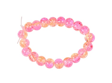 Pink bracelet of glass beads isolated on white background