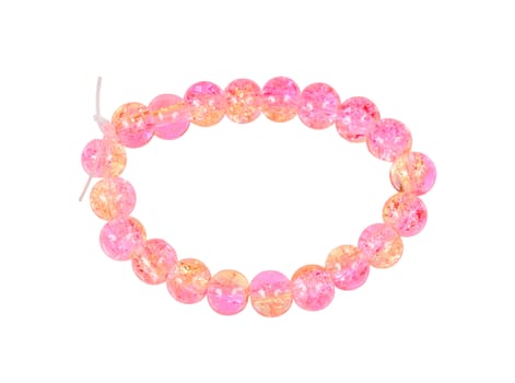 Pink bracelet of glass beads isolated on white background