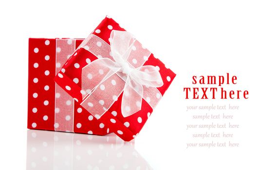 red gift box with  bow on white background