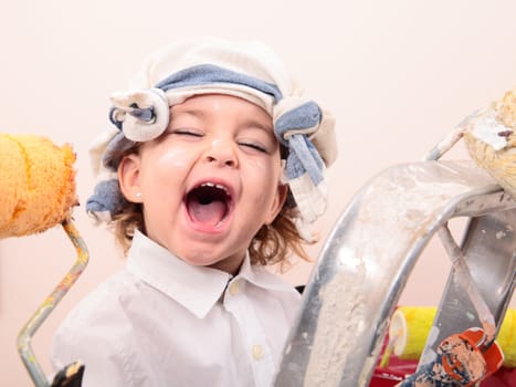 beautiful little girl painting and screaming