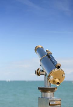 Coin opperated telescope to view the seascape on a french island