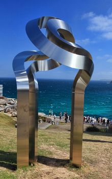 Bondi - Tamarama Beach, Australia - November 9,  2013: Sculpture By The Sea, 2013. Annual cultural event that showcases artists from around the world  Exhibit titled 'transfiguration "engage" VII ' by Mitsuo Takeuchi (Japan).  Medium -  stainless steel  $90000