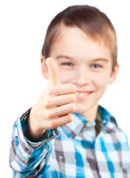 Portrait of cute boy showing thumb up on white background
