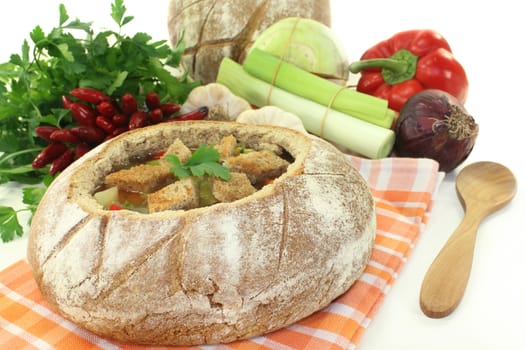 a farmhouse bread stuffed with a colorful bread soup