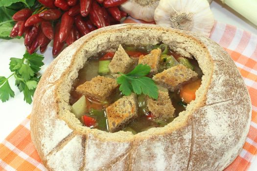 a farmhouse bread stuffed with a colorful bread soup