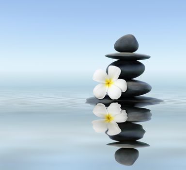 Zen spa concept background - Zen massage stones with frangipani plumeria flower in water reflection