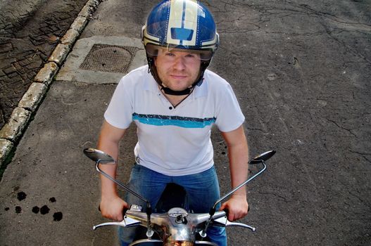 Young man on a scooter