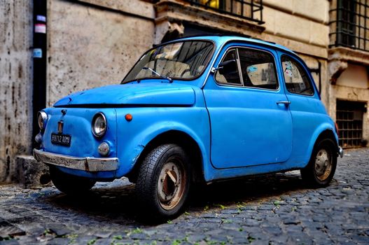 ROME - SEPTEMBER 20: A Fiat 500 on September 20, 2013 in Rome. Fiat 500 was produced by the Fiat company from 1957 to 75. New version of the car started production in 2007. Taken in Rome, Italy on September 20, 2013