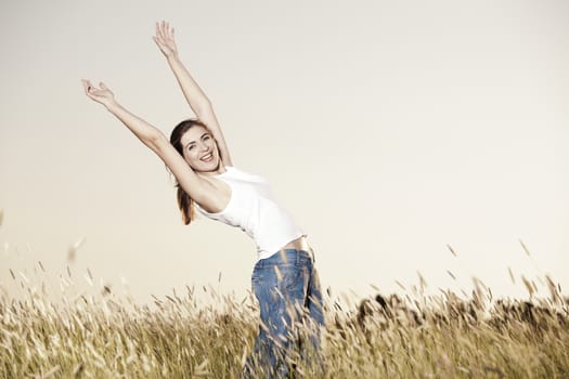 Outdoor portrait of a woman on a meadow releaxing