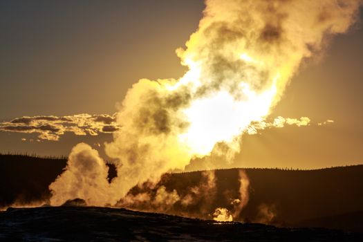 Sunset of Old Faithful in Yellowstone National Park