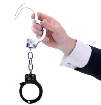 businessman hand holding out handcuffs isolated on white