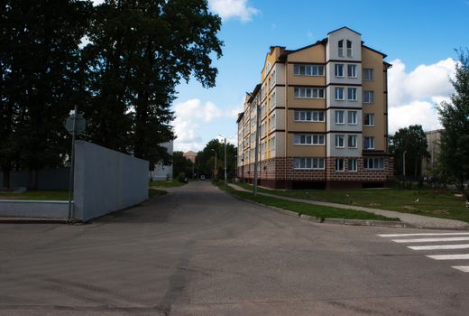 apartment building on the city street on summer day