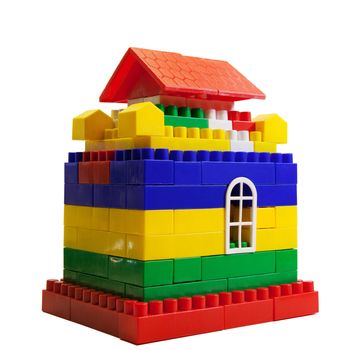toy house out of colored blocks isolated on a white background