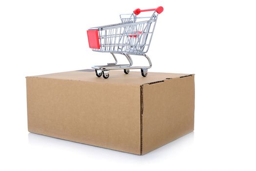 concept of internet shopping of a push cart isolated on top of a package