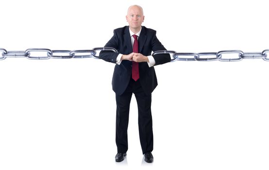 A powerfull businessman holding chains together isolated on a white background