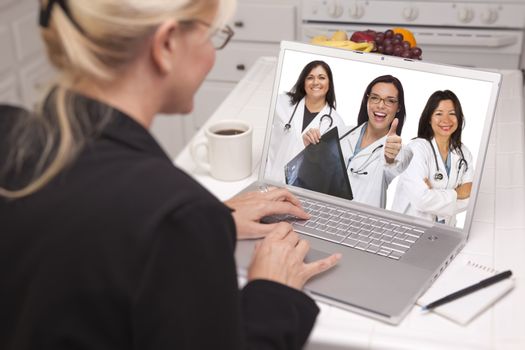 Woman Sitting In Kitchen Using Laptop Viewing Team of Hispanic Female Doctors or Nurses with Thumbs Up Holding X-ray.
