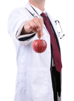 a doctor handing out a red apple advise of healthy eating