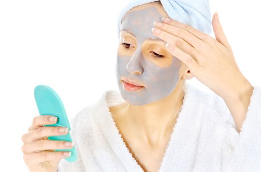 Young woman taking care of her skin