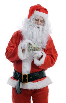 Counting the cost of christmas, santa counting dollars isolated on a white background