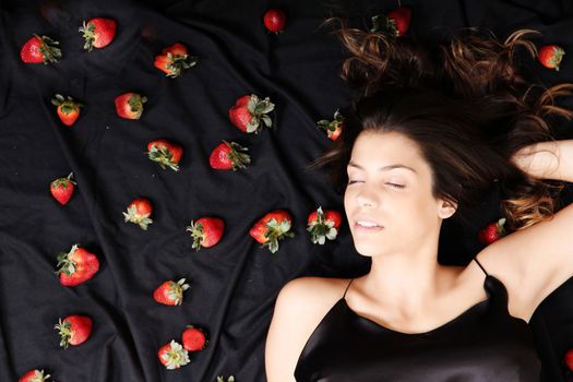 A young adult american woman dreaming of strawberries.