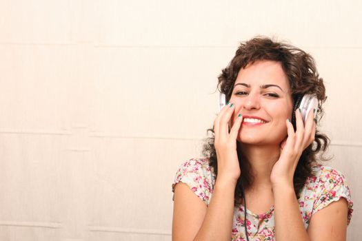 A young woman listening music with Headphones.