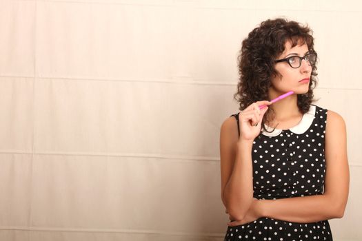 Portrait of a pensive woman in a vintage dress.