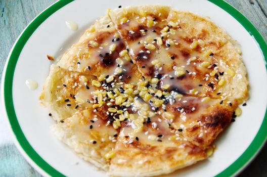 Southern flat bread with sweetened condensed milk and seasame 