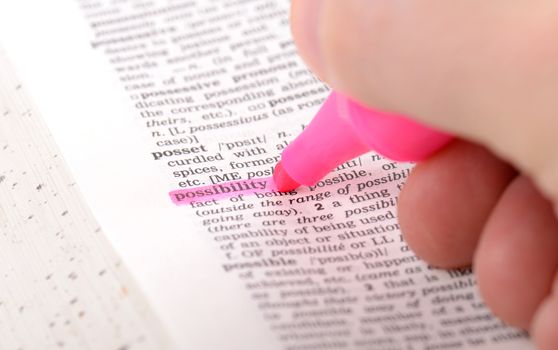 highlighting possibilty with a marker pen on fake dictionary