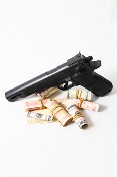 Financial Crime Concept Gun and Money on a White Background