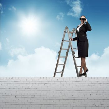 businesswoman climbed a ladder and looking through binoculars