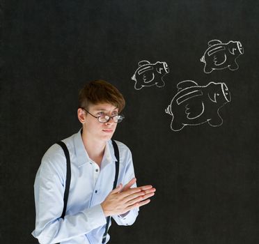 Businessman planning with flying money piggy banks in chalk on blackboard background