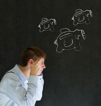 Thinking businessman with flying money piggy banks in chalk on blackboard background