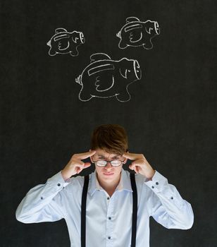 Thinking businessman with flying money piggy banks in chalk on blackboard background